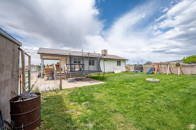 1790 E Homestead, Enoch, UT 84721 - back of house with a trampoline, a patio, and a playground