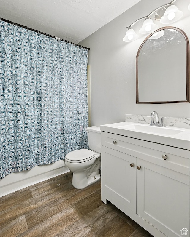 1790 E Homestead, Enoch, UT 84721 - bathroom with toilet, vanity, wood finished floors, and shower / tub combo with curtain