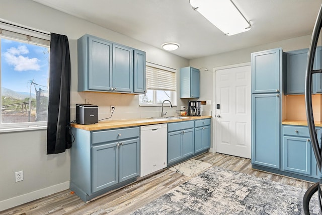 1790 E Homestead, Enoch, UT 84721 - kitchen featuring white dishwasher, butcher block countertops, blue cabinetry, and a sink