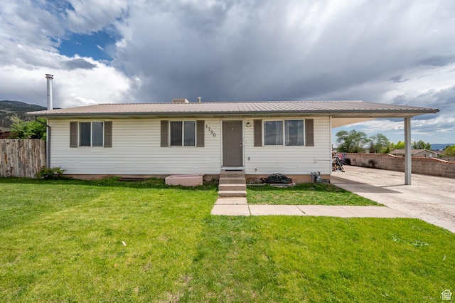 1790 E Homestead, Enoch, UT 84721 - view of front of house with a carport, concrete driveway, metal roof, and entry steps