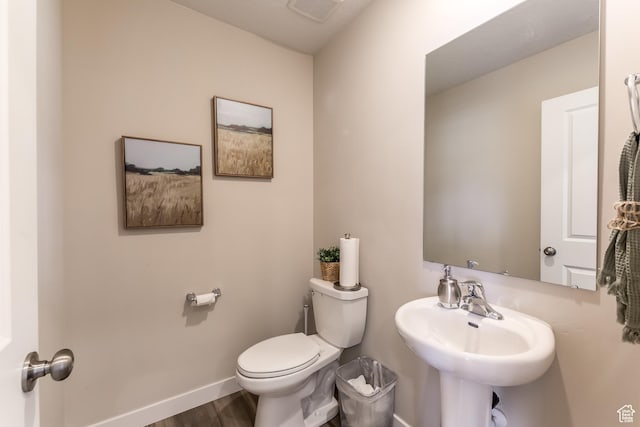1803 E Bison Dr Unit B212, Eagle Mountain, UT 84005 - bathroom with toilet, baseboards, wood finished floors, and a sink