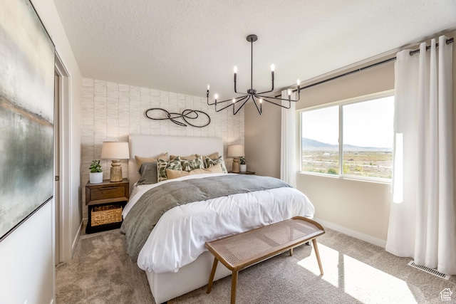 1803 E Bison Dr Unit B212, Eagle Mountain, UT 84005 - bedroom with light colored carpet, a chandelier, and baseboards