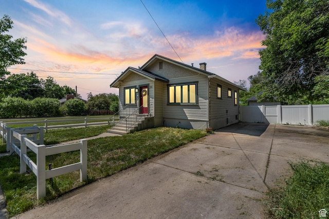 381 E 300 S, Logan, UT 84321 - bungalow-style house with concrete driveway and a chimney