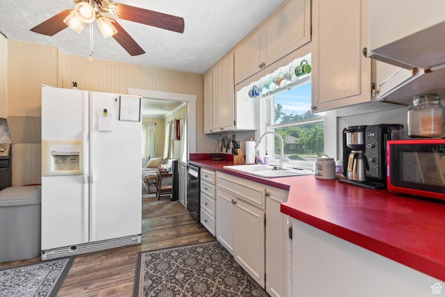 381 E 300 S, Logan, UT 84321 - kitchen with white fridge with ice dispenser, a sink, black dishwasher, dark wood-style flooring, and ceiling fan
