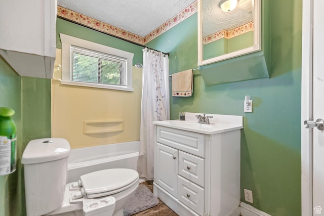 381 E 300 S, Logan, UT 84321 - bathroom featuring a textured ceiling, toilet, vanity, and shower / bath combo