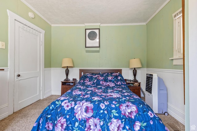 381 E 300 S, Logan, UT 84321 - bedroom with carpet floors, a wainscoted wall, a textured ceiling, and ornamental molding