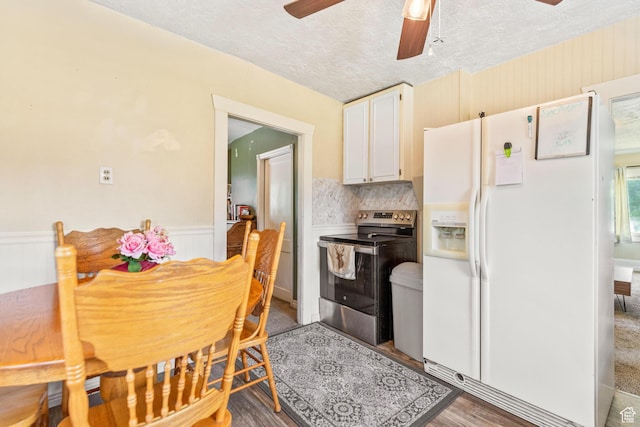 381 E 300 S, Logan, UT 84321 - kitchen featuring electric stove, white fridge with ice dispenser, ceiling fan, a textured ceiling, and white cabinets
