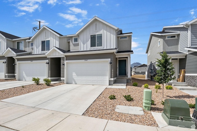 3547 E 1360 S, Spanish Fork, UT 84660 - townhome / multi-family property with board and batten siding, a garage, and driveway