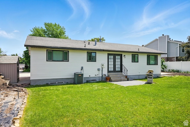 9604 S Stornoway Cir W, South Jordan, UT 84009 - back of property with french doors, entry steps, central AC unit, and a patio