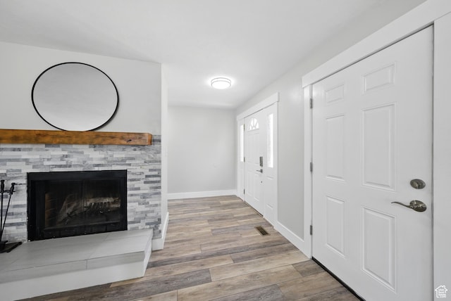 9604 S Stornoway Cir W, South Jordan, UT 84009 - foyer entrance with wood finished floors, baseboards, and a fireplace