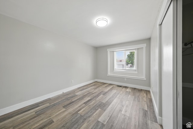 9604 S Stornoway Cir W, South Jordan, UT 84009 - spare room featuring wood finished floors and baseboards