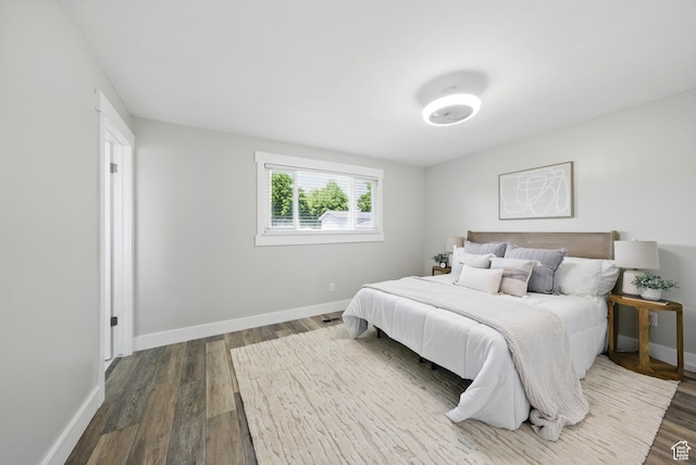 9604 S Stornoway Cir W, South Jordan, UT 84009 - bedroom featuring dark wood-style flooring and baseboards