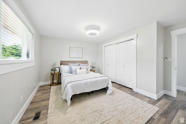 9604 S Stornoway Cir W, South Jordan, UT 84009 - bedroom featuring wood finished floors, baseboards, and a closet