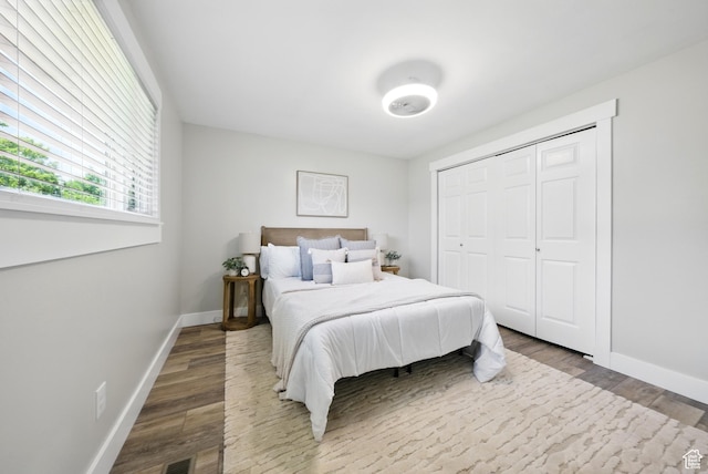 9604 S Stornoway Cir W, South Jordan, UT 84009 - bedroom with wood finished floors, baseboards, and a closet
