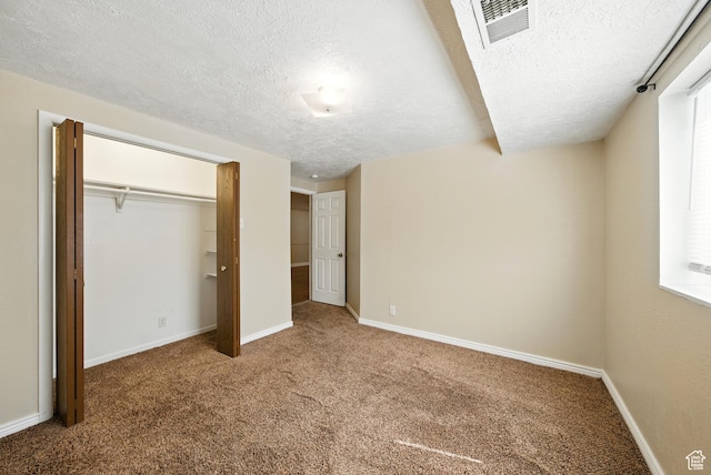 9604 S Stornoway Cir W, South Jordan, UT 84009 - unfurnished bedroom with a textured ceiling, carpet floors, baseboards, and a closet