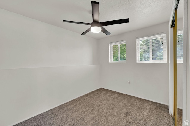 1368 E 5800 S, South Ogden, UT 84405 - spare room featuring carpet, ceiling fan, baseboards, and a textured ceiling