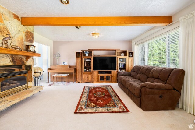 1478 N Ewe Turn St E, Kaysville, UT 84037 - carpeted living room with beamed ceiling, a textured ceiling, and a stone fireplace