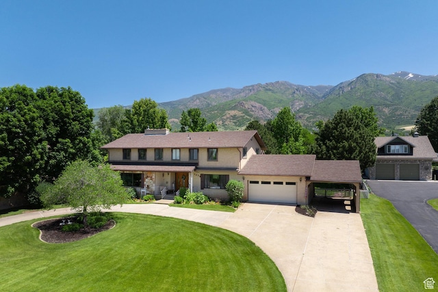 1478 N Ewe Turn St E, Kaysville, UT 84037 - traditional-style house featuring driveway, a front yard, a garage, and a mountain view