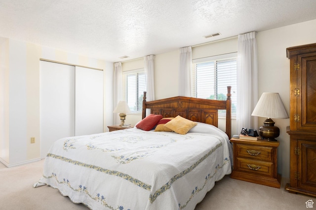 1478 N Ewe Turn St E, Kaysville, UT 84037 - bedroom with light carpet, a textured ceiling, and a closet