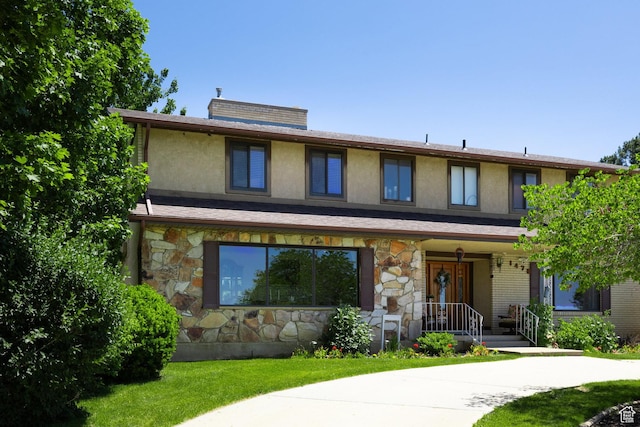 1478 N Ewe Turn St E, Kaysville, UT 84037 - view of front of property with stone siding, a porch, stucco siding, and a front yard
