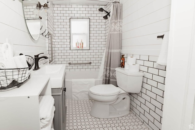 5363 E Cub Rd, Preston, ID 83263 - full bathroom featuring tile walls, vanity, toilet, shower / bath combo, and tile patterned flooring
