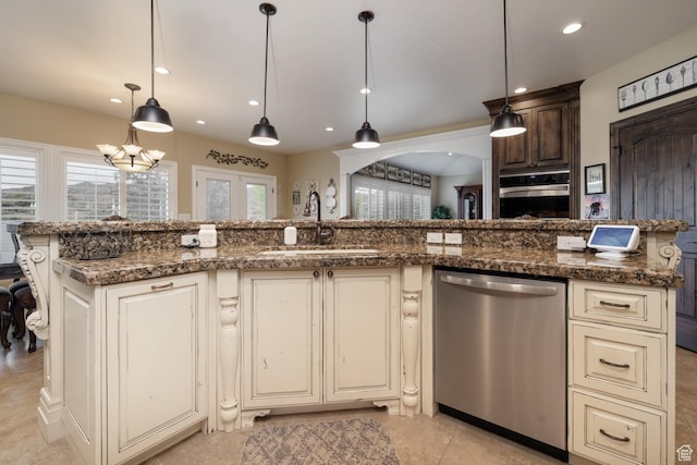 403 W 4000 S, Vernal, UT 84078 - kitchen with dishwasher, a sink, recessed lighting, cream cabinets, and dark stone counters