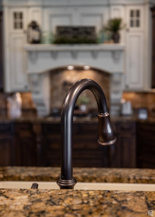 403 W 4000 S, Vernal, UT 84078 - detailed view of white cabinetry, glass insert cabinets, a sink, and dark countertops