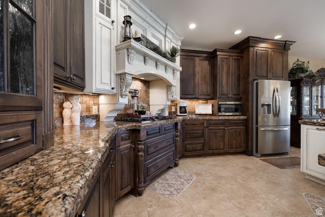 403 W 4000 S, Vernal, UT 84078 - kitchen featuring stainless steel appliances, dark brown cabinetry, backsplash, dark stone countertops, and recessed lighting
