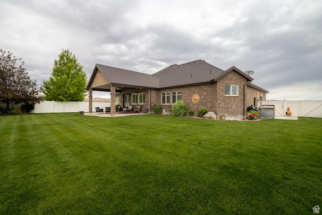 403 W 4000 S, Vernal, UT 84078 - rear view of property featuring a patio area, brick siding, and roof with shingles