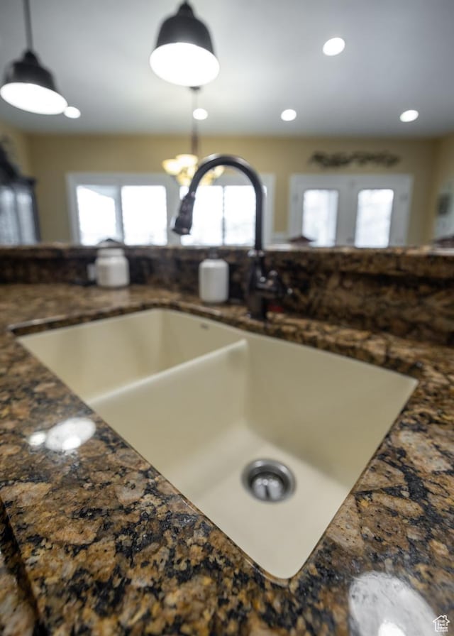 403 W 4000 S, Vernal, UT 84078 - kitchen view of a sink, hanging light fixtures, dark countertops, and recessed lighting