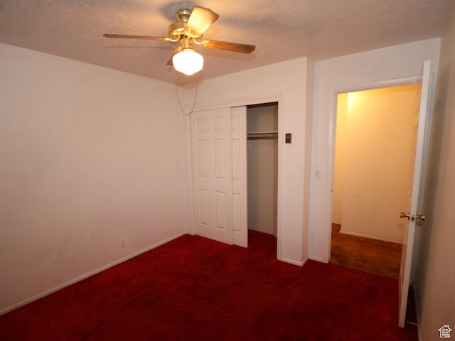 338 E 200 S Unit 338, Logan, UT 84321 - unfurnished bedroom featuring dark colored carpet, a closet, a ceiling fan, and baseboards