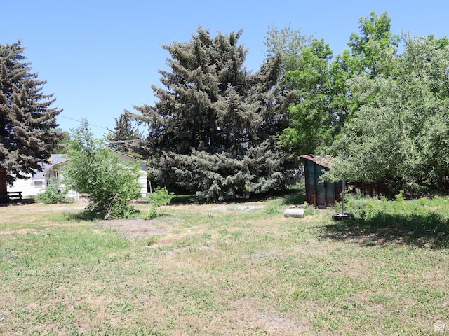 338 E 200 S Unit 338, Logan, UT 84321 - view of green lawn featuring an outdoor structure