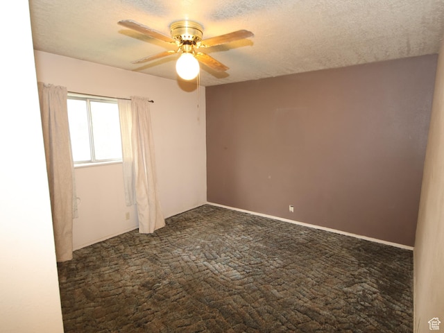 338 E 200 S Unit 338, Logan, UT 84321 - unfurnished room with dark colored carpet, ceiling fan, and a textured ceiling