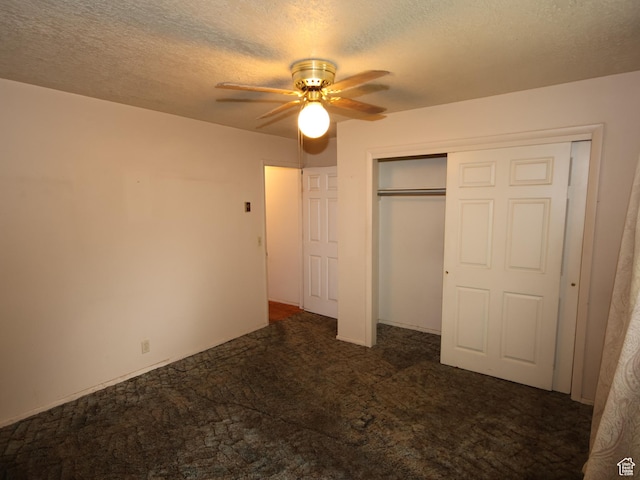 338 E 200 S Unit 338, Logan, UT 84321 - unfurnished bedroom with carpet, a textured ceiling, a closet, and a ceiling fan