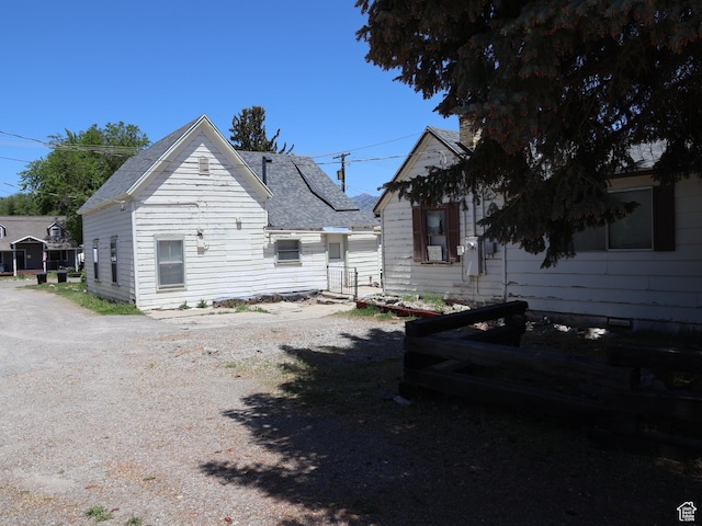 338 E 200 S Unit 338, Logan, UT 84321 - view of side of home featuring a shingled roof