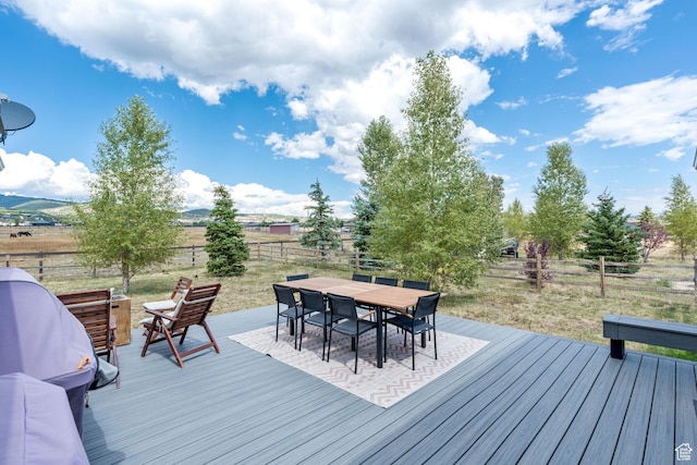 7850 Wasatch Way, Park City, UT 84098 - wooden deck with outdoor dining area, a fenced backyard, and a view of rural / pastoral area