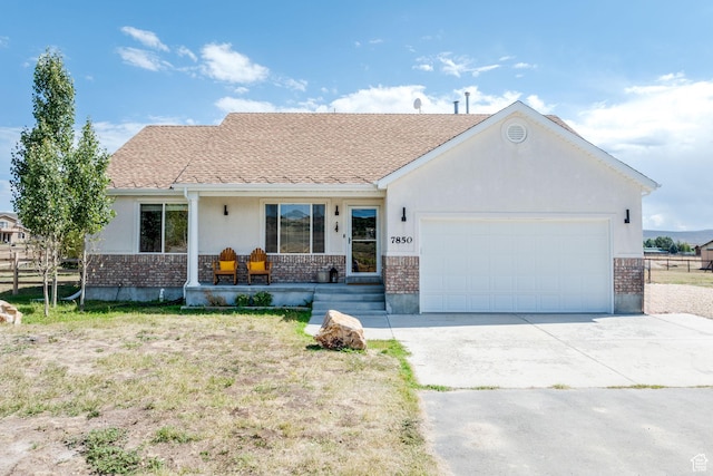 7850 Wasatch Way, Park City, UT 84098 - ranch-style home with brick siding, an attached garage, and driveway