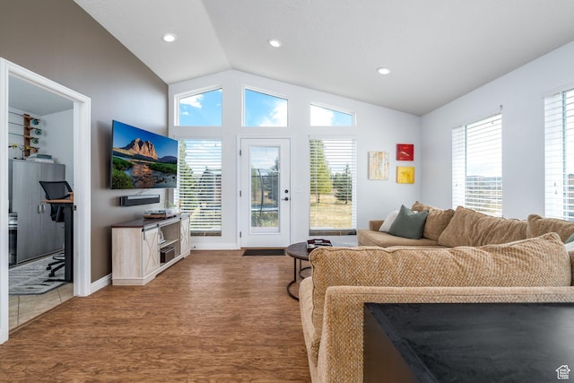 7850 Wasatch Way, Park City, UT 84098 - living room featuring vaulted ceiling, wood finished floors, healthy amount of natural light, recessed lighting, and baseboards