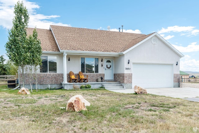 7850 Wasatch Way, Park City, UT 84098 - ranch-style house with brick siding, covered porch, an attached garage, driveway, and a shingled roof
