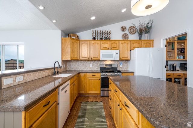 7850 Wasatch Way, Park City, UT 84098 - kitchen featuring white appliances, a sink, lofted ceiling, tasteful backsplash, and a textured ceiling