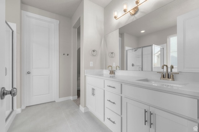 1839 S 2475 W, West Haven, UT 84401 - bathroom featuring a stall shower, double vanity, tile patterned flooring, and baseboards