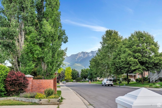 4055 N Cove Dr, Provo, UT 84604 - view of asphalt road featuring curbs, a mountain view, and sidewalks