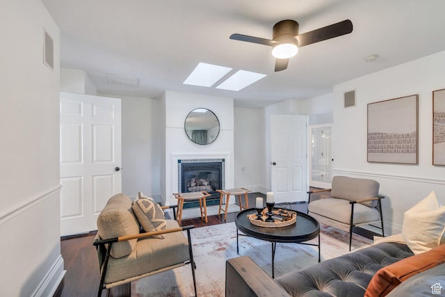 4055 N Cove Dr, Provo, UT 84604 - living room featuring a skylight, wood finished floors, ceiling fan, and baseboards