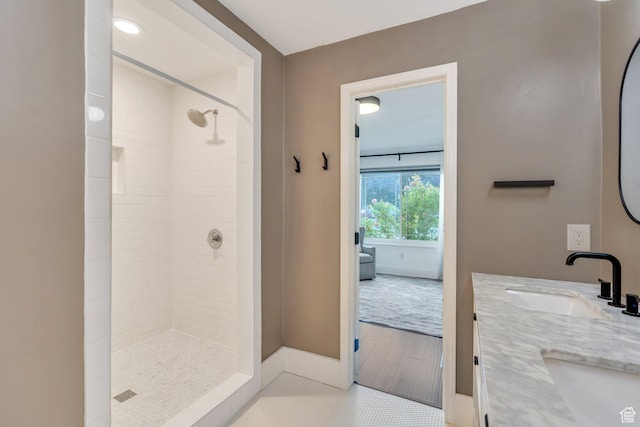 4055 N Cove Dr, Provo, UT 84604 - full bathroom with tiled shower, double vanity, tile patterned floors, and baseboards