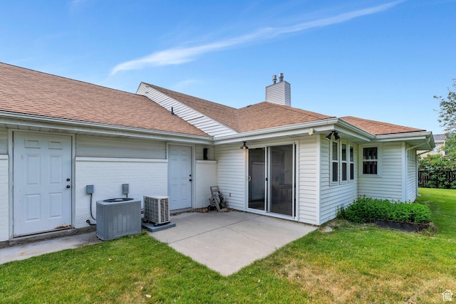 4055 N Cove Dr, Provo, UT 84604 - back of property with central AC unit, a chimney, a lawn, a patio area, and a shingled roof