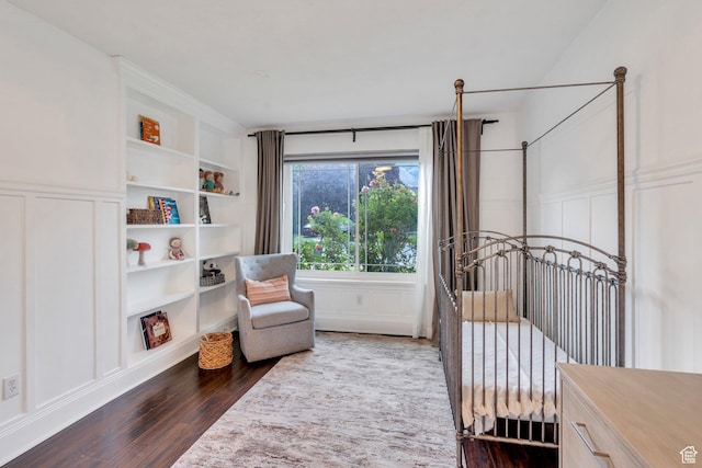 4055 N Cove Dr, Provo, UT 84604 - bedroom featuring a decorative wall, dark wood finished floors, and wainscoting