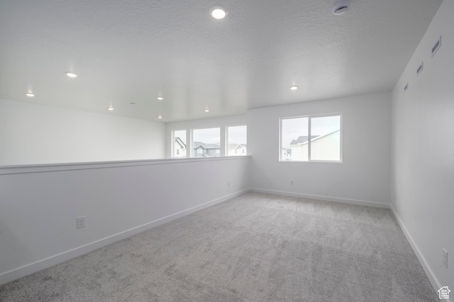 1847 E Badger Ave N Unit B253, Eagle Mountain, UT 84005 - carpeted empty room featuring a smoke detector, baseboards, and recessed lighting