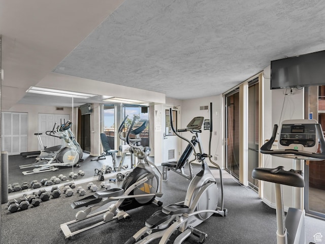 105 S 1100 E Unit 508, Salt Lake City, UT 84102 - gym featuring a textured ceiling and baseboards