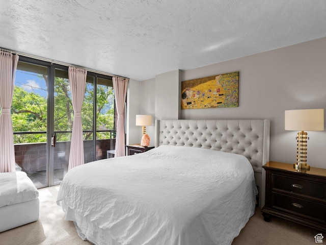 105 S 1100 E Unit 508, Salt Lake City, UT 84102 - carpeted bedroom featuring access to exterior and a textured ceiling