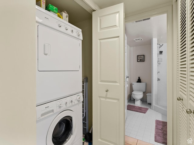 105 S 1100 E Unit 508, Salt Lake City, UT 84102 - laundry room featuring stacked washer and clothes dryer and light tile patterned floors